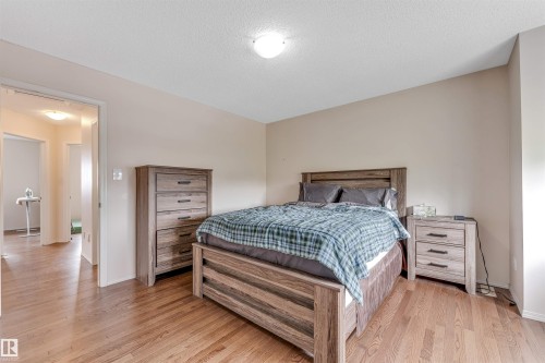 Hardwood flooring throughout, neutral wall tones, and recessed lighting - 3032 31 Avenue Nw, Edmonton, AB - Indoor Photo Showing Bedroom