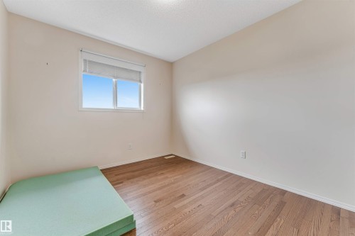 Hardwood-finish flooring and a window with horizontal blinds - 3032 31 Avenue Nw, Edmonton, AB - Indoor Photo Showing Other Room