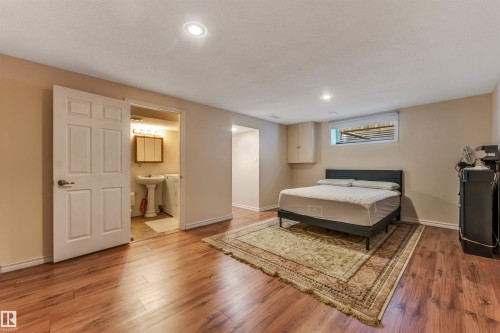 Wood-finish flooring, recessed lighting, and a window with blinds - 3032 31 Avenue Nw, Edmonton, AB - Indoor