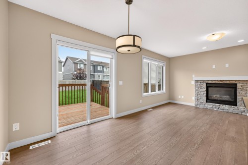 2730 Sparrow Place Nw, Edmonton, AB - Indoor Photo Showing Living Room With Fireplace