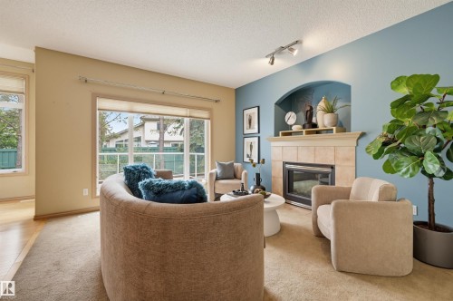 708 Haliburton Crescent Nw, Edmonton, AB - Indoor Photo Showing Living Room With Fireplace