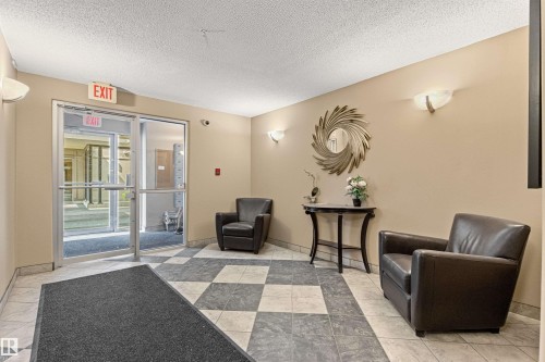 Checkered tile flooring and a neutral color palette - #404 11103 84 Av Nw, Edmonton, AB - Indoor Photo Showing Other Room