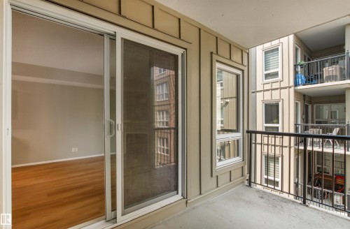 Balcony with concrete flooring and black metal railings - #404 11103 84 Av Nw, Edmonton, AB - Outdoor With Balcony With Exterior