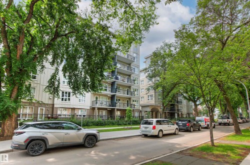 Modern multi-story building featuring balconies and large windows - #404 11103 84 Av Nw, Edmonton, AB - Outdoor With Balcony With Facade