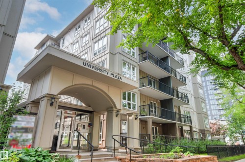 Multi-story building with a prominent arched entrance, multiple private balconies, and extensive windowing - #404 11103 84 Av Nw, Edmonton, AB - Outdoor With Balcony With Facade