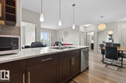 #307 1144 Adamson Dr Sw Sw, Edmonton, AB - Indoor Photo Showing Kitchen With Double Sink