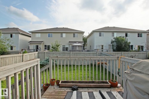 Expansive wood deck with a built-in planter box - #42 4350 23 St Nw, Edmonton, AB - Outdoor