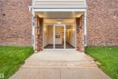 Brick exterior with a covered entry - 201-7825 159 Street Nw, Edmonton, AB  - Outdoor 