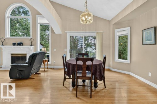 925 Burrows Crescent Nw, Edmonton, AB - Indoor Photo Showing Dining Room With Fireplace