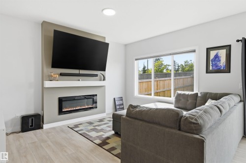 185 Larch Crescent, Leduc, AB - Indoor Photo Showing Living Room With Fireplace