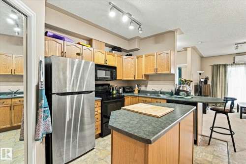#403 10046 110 St Nw, Edmonton, AB - Indoor Photo Showing Kitchen With Double Sink