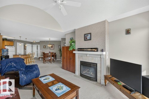 #411 8922 156 St Nw, Edmonton, AB - Indoor Photo Showing Living Room With Fireplace