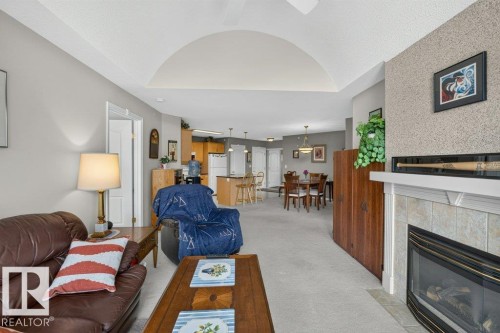 #411 8922 156 St Nw, Edmonton, AB - Indoor Photo Showing Living Room With Fireplace