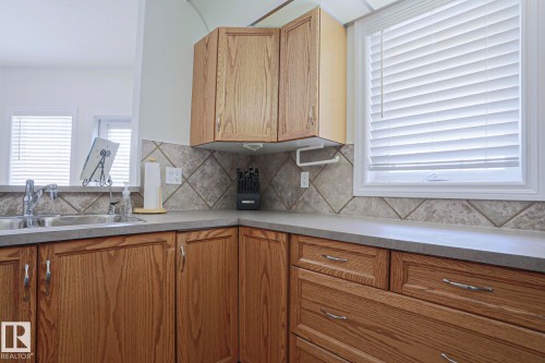 #131 11260 153 Av Nw, Edmonton, AB - Indoor Photo Showing Kitchen With Double Sink