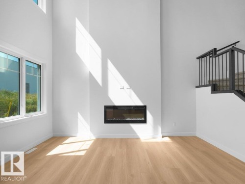 1423 Osprey Crest Nw, Edmonton, AB - Indoor Photo Showing Other Room With Fireplace