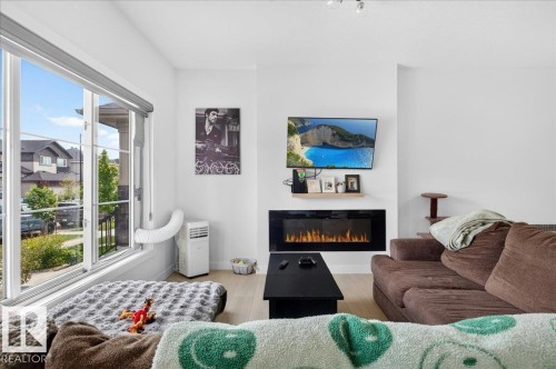 82 Wyatt Ridge, Fort Saskatchewan, AB - Indoor Photo Showing Living Room With Fireplace