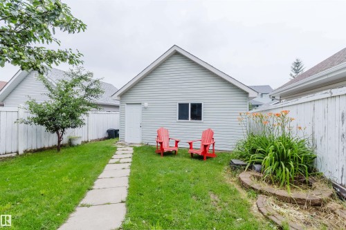 Detached garage with horizontal siding and a single window - 1694 Tompkins Wynd Nw, Edmonton, AB - Outdoor