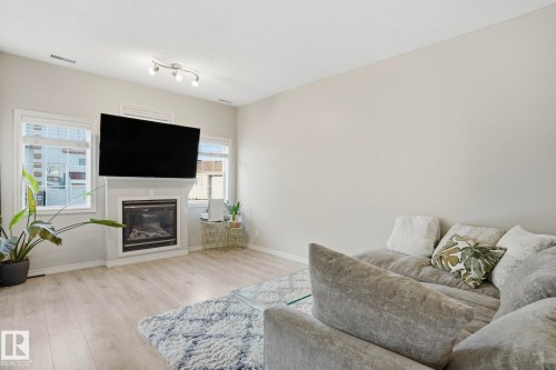 #52 13825 155 Av Nw, Edmonton, AB - Indoor Photo Showing Living Room With Fireplace