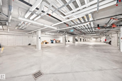 Concrete flooring with integrated drainage - #322 148 Ebbers Bv Nw, Edmonton, AB - Indoor Photo Showing Garage