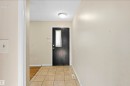 Tile flooring entryway with a flush mount ceiling light - 13604 90A Street Nw, Edmonton, AB  - Indoor Photo Showing Other Room 