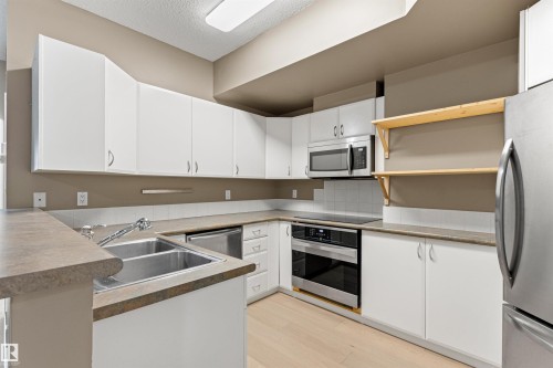 #417 10717 83 Av Nw, Edmonton, AB - Indoor Photo Showing Kitchen With Double Sink