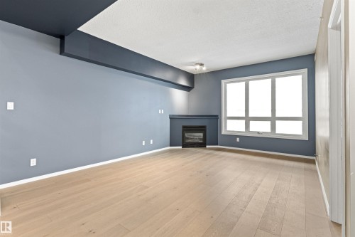 #417 10717 83 Av Nw, Edmonton, AB - Indoor Photo Showing Other Room With Fireplace