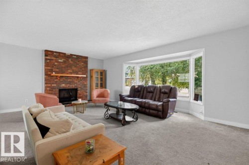 3205 104A Street Nw, Edmonton, AB - Indoor Photo Showing Living Room With Fireplace