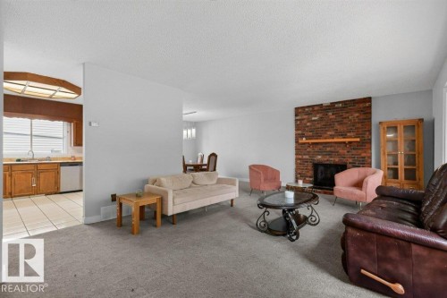 3205 104A Street Nw, Edmonton, AB - Indoor Photo Showing Living Room With Fireplace