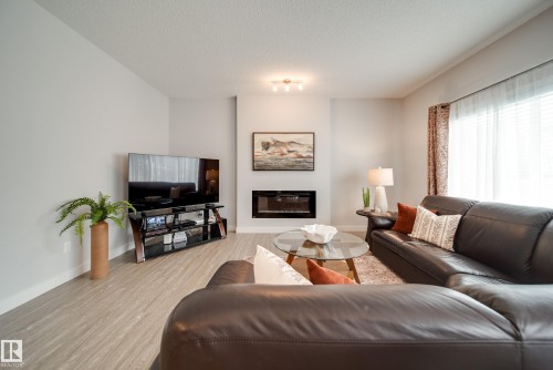 7314 Edgemont Way Nw, Edmonton, AB - Indoor Photo Showing Living Room With Fireplace