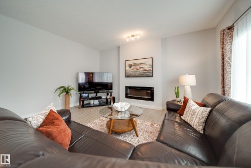 7314 Edgemont Way Nw, Edmonton, AB - Indoor Photo Showing Living Room With Fireplace