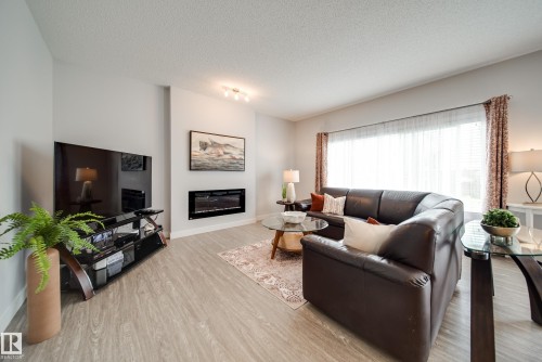7314 Edgemont Way Nw, Edmonton, AB - Indoor Photo Showing Living Room With Fireplace