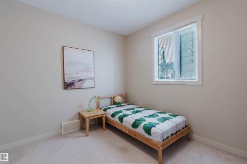 Neutral-toned walls, white window trim, and light-colored carpeting - 3843 Agar Green Sw, Edmonton, AB - Indoor Photo Showing Bedroom