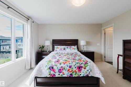 Neutral wall color, wall-to-wall carpeting, white trim, recessed ceiling light fixture, and a window with white casing - 3843 Agar Green Sw, Edmonton, AB - Indoor Photo Showing Bedroom