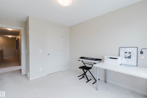 Neutral wall paint, carpeted flooring, and a flush mount ceiling light - 3843 Agar Green Sw, Edmonton, AB - Indoor