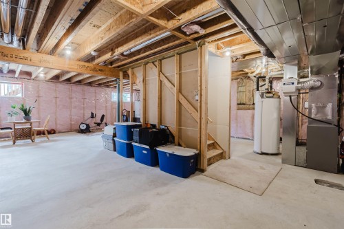 Unfinished basement with exposed ceiling joists and concrete flooring - 3843 Agar Green Sw, Edmonton, AB - Indoor Photo Showing Basement