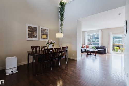 Hardwood flooring throughout, vaulted ceiling, and white trim - 3843 Agar Green Sw, Edmonton, AB - Indoor Photo Showing Dining Room