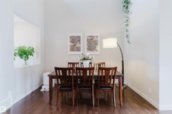 Hardwood-style flooring, light-toned walls, and a built-in wall niche - 