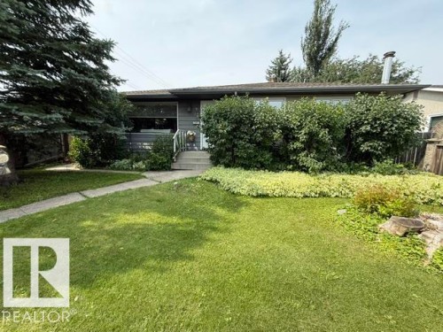 Ranch-style residence featuring a gray exterior siding and a concrete walkway - 13508 64 Street Nw, Edmonton, AB - Outdoor