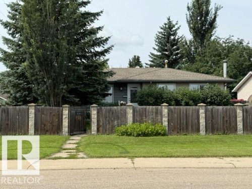 Ranch-style exterior featuring a brown shingle roof and a front entry - 13508 64 Street Nw, Edmonton, AB - Outdoor