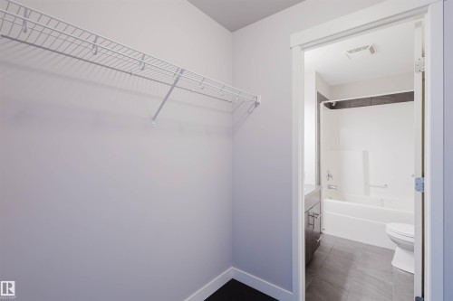 Wire shelving system - #2207 10226 104 St Nw, Edmonton, AB - Indoor With Storage