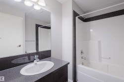 Vanity with integrated oval sink, chrome faucet, and spacious countertop - 