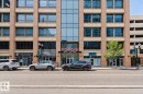 Multi-story commercial building featuring brick and glass facade - #2207 10226 104 St Nw, Edmonton, AB  - Outdoor With Balcony With Facade 