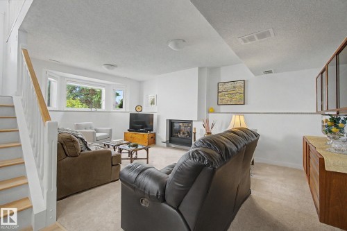 32 Fairway Drive, Spruce Grove, AB - Indoor Photo Showing Living Room With Fireplace