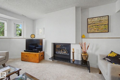 32 Fairway Drive, Spruce Grove, AB - Indoor Photo Showing Living Room With Fireplace