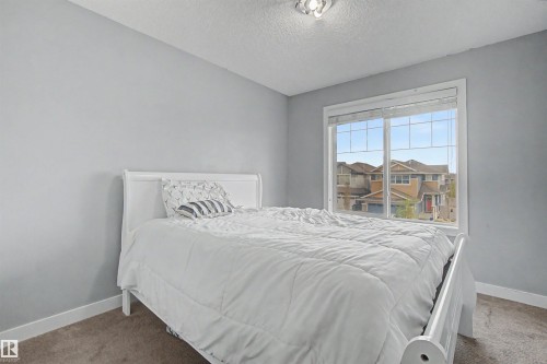 Wall-to-wall carpeting with light gray walls and white trim - 1602 Chapman Way Sw, Edmonton, AB - Indoor Photo Showing Bedroom