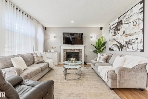 1235 Ormsby Lane Nw, Edmonton, AB - Indoor Photo Showing Living Room With Fireplace