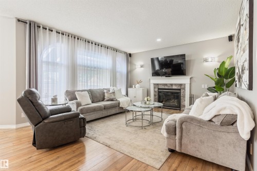 1235 Ormsby Lane Nw, Edmonton, AB - Indoor Photo Showing Living Room With Fireplace