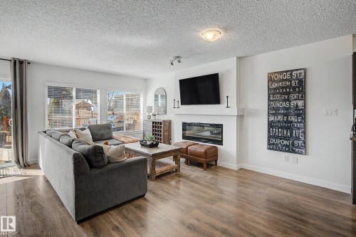 2083 Chalmers Way Sw, Edmonton, AB - Indoor Photo Showing Living Room With Fireplace
