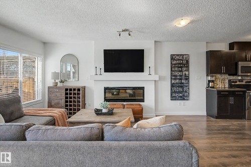2083 Chalmers Way Sw, Edmonton, AB - Indoor Photo Showing Living Room With Fireplace