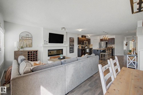 2083 Chalmers Way Sw, Edmonton, AB - Indoor Photo Showing Living Room With Fireplace